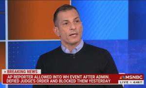 still of Carusone; chyron: AP reporter allowed into WH event after admin. defied judge's order and blocked them yesterday 