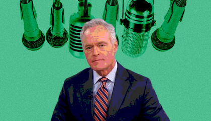 Scott Pelley in front of microphones 