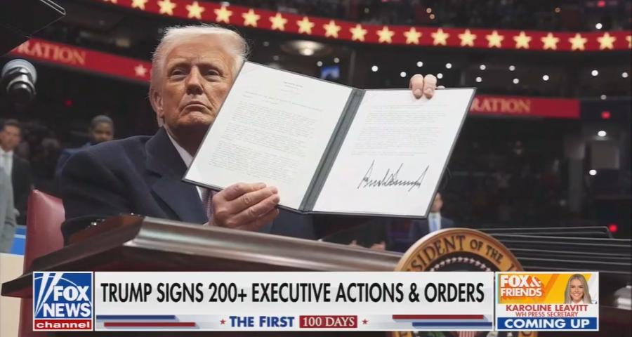 Fox News screenshot of Donald Trump holding up an executive order
